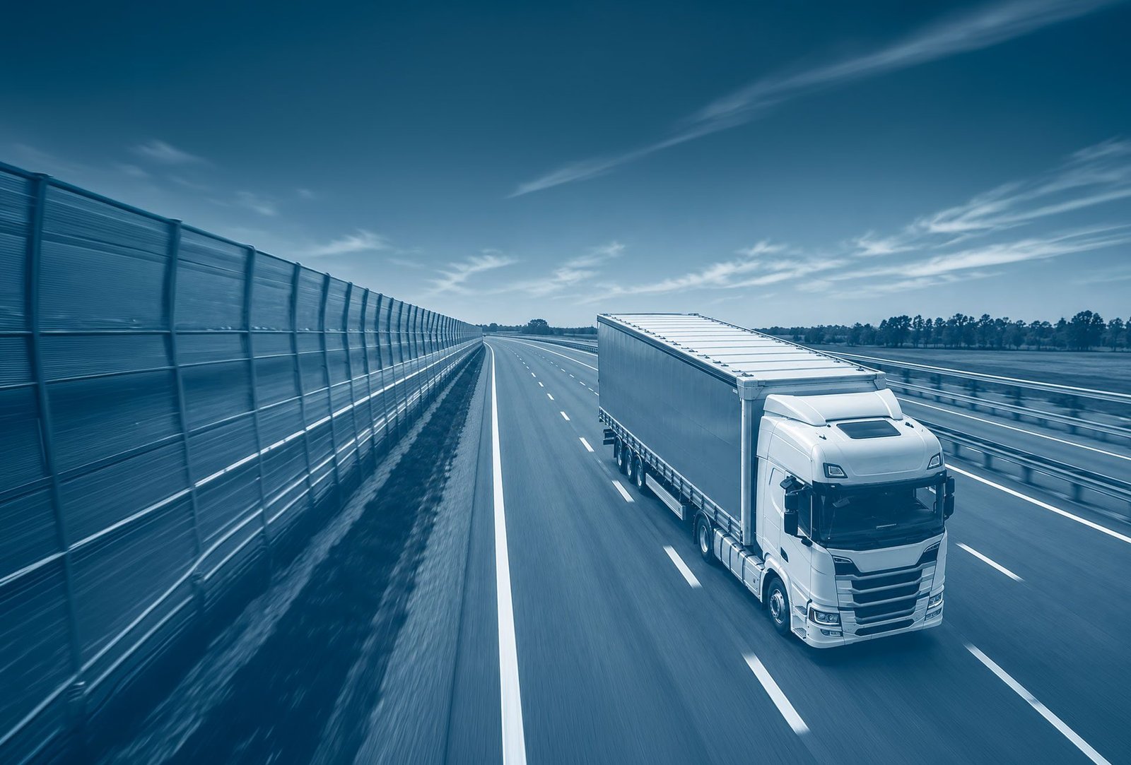 truck + trailer on the road, blue hour · no OEM logos